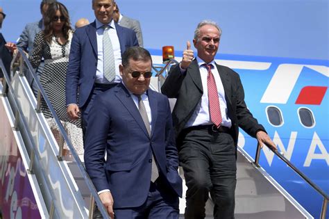 One of Libya’s rival prime ministers returns to Tripoli on 1st commercial flight from Italy in years